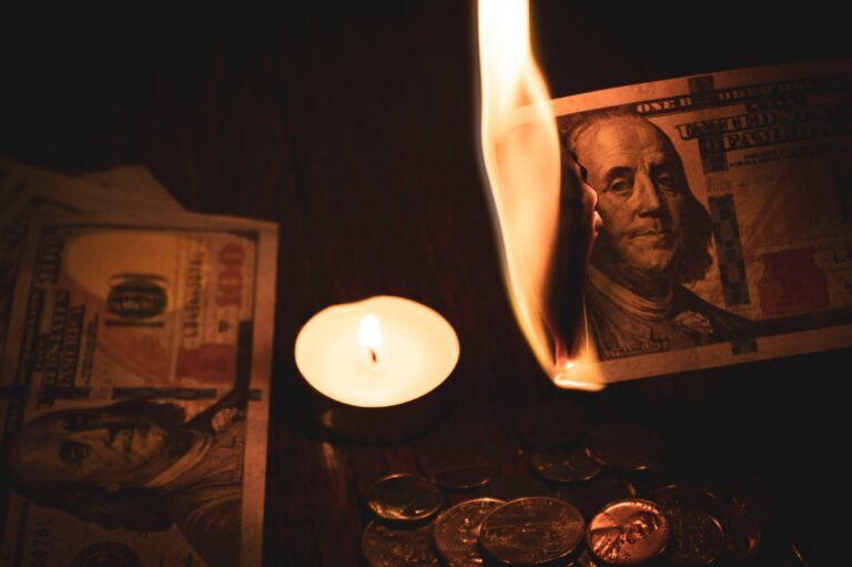 money lit on fire